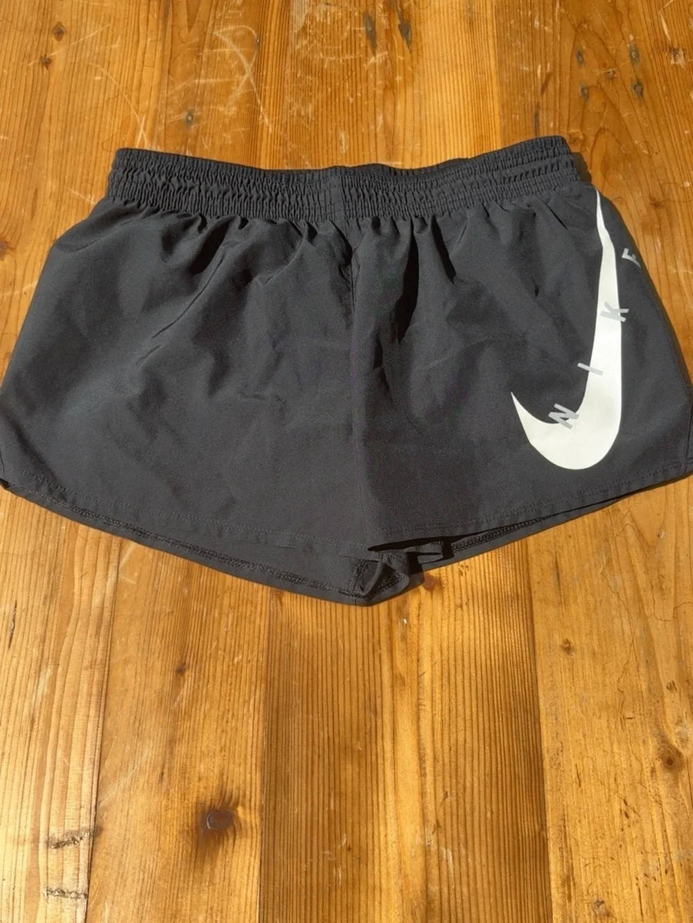 Nike Women’s Black Athletic Shorts with White Swoosh